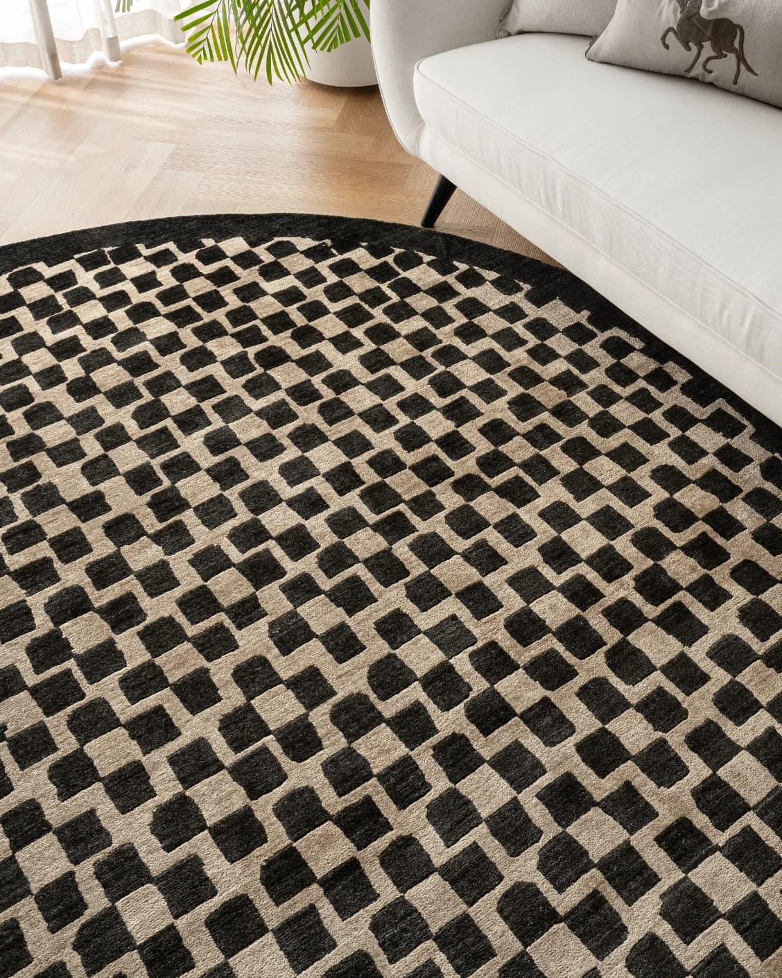 Chess Ebony Round carpet in ebony, beige and black, shown in a lifestyle right view as image 7
