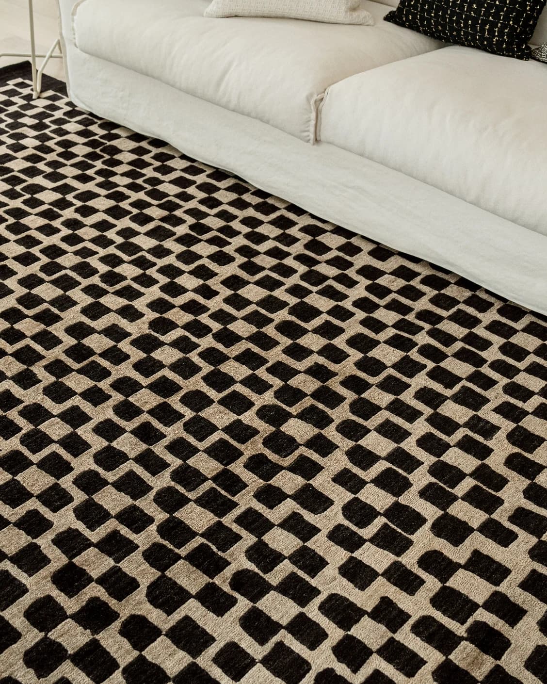 Chess Ebony carpet in beige and black, shown in a lifestyle right view as image 9