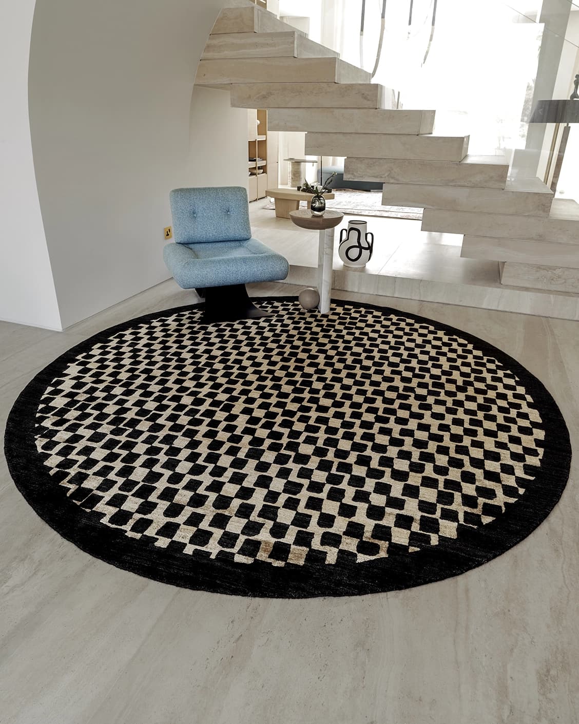 Chess Ebony Round carpet in ebony, beige and black, shown in a lifestyle front view as image 2
