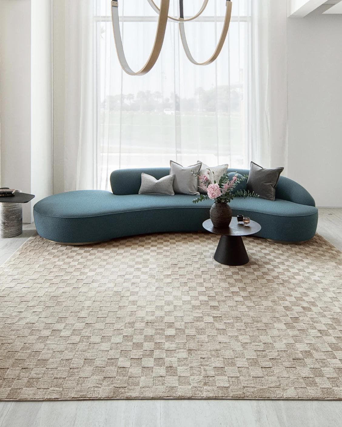 Cindy Dune Round carpet in taupe and beige, shown in a lifestyle front view as image 4