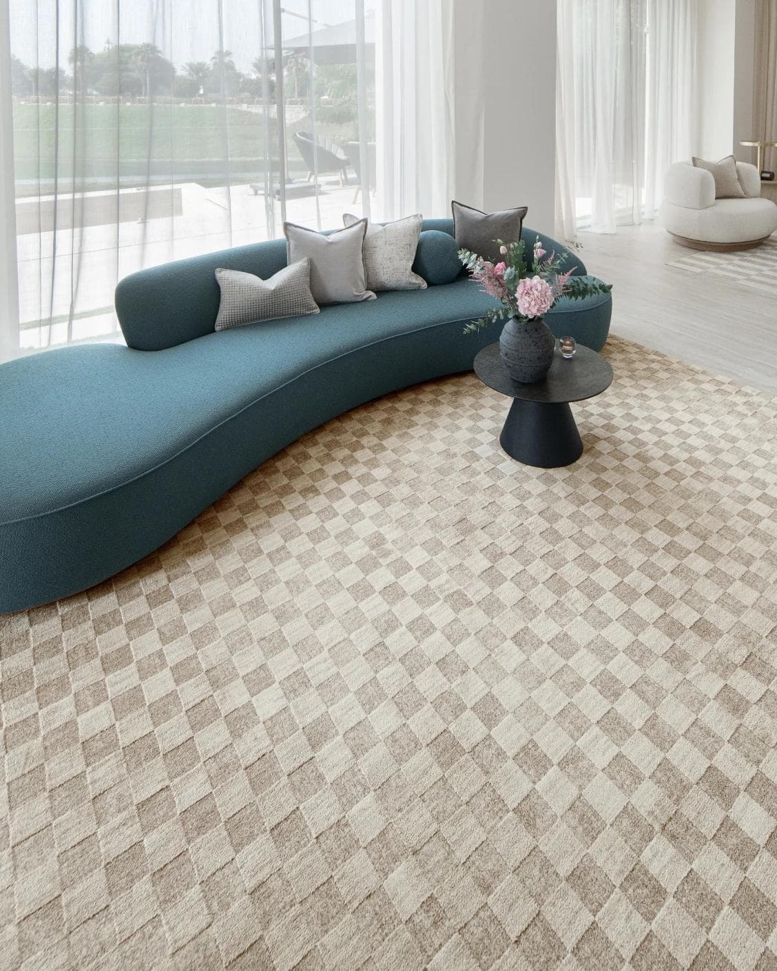 Cindy Dune Round carpet in taupe and beige, shown in a lifestyle front view as image 5