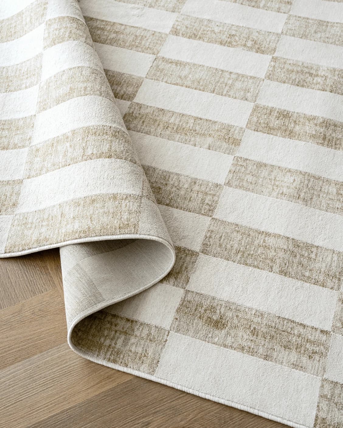 Cindy Tan carpets in taupe and beige, shown in a product close-up as image 1
