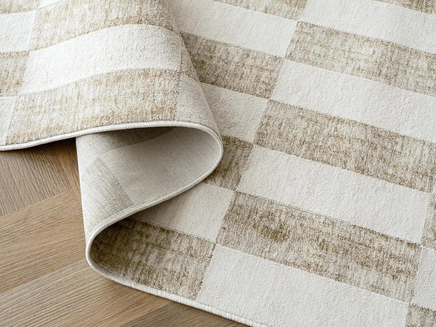 Cindy Tan carpets in taupe and beige, shown in a product close-up as image 1