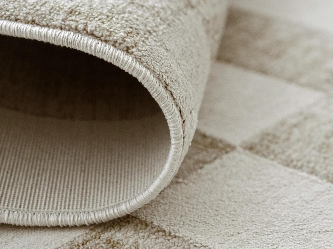 Cindy Tan carpets in taupe and beige, shown in a product close-up as image 2