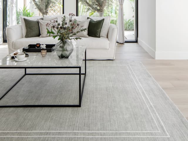 Colin Alba Round carpet in white and grey, shown in a lifestyle front view as image 5