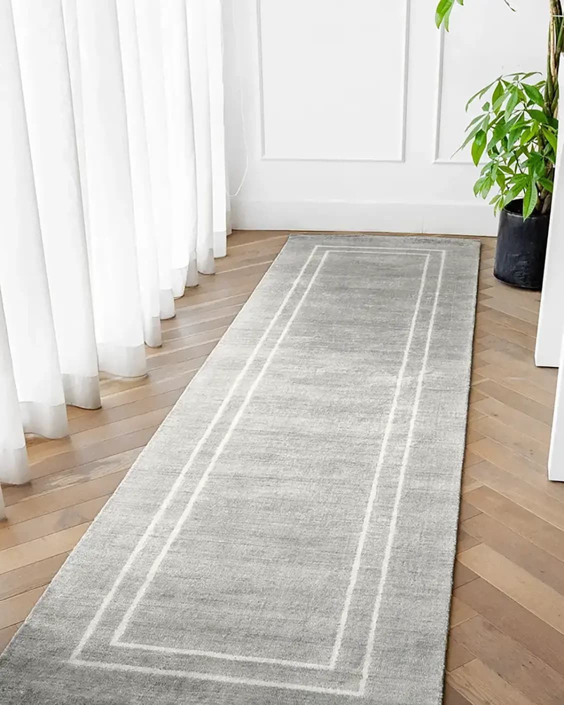 Colin Alba Runners carpet in white and grey, shown in a lifestyle top view as image 2