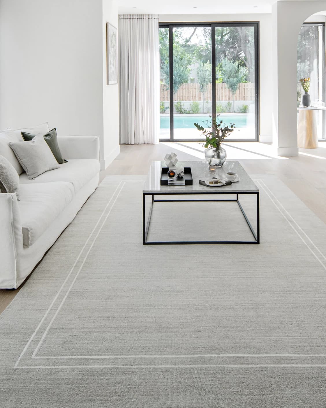 Colin Alba carpet in white and grey, shown in a lifestyle front view as image 6