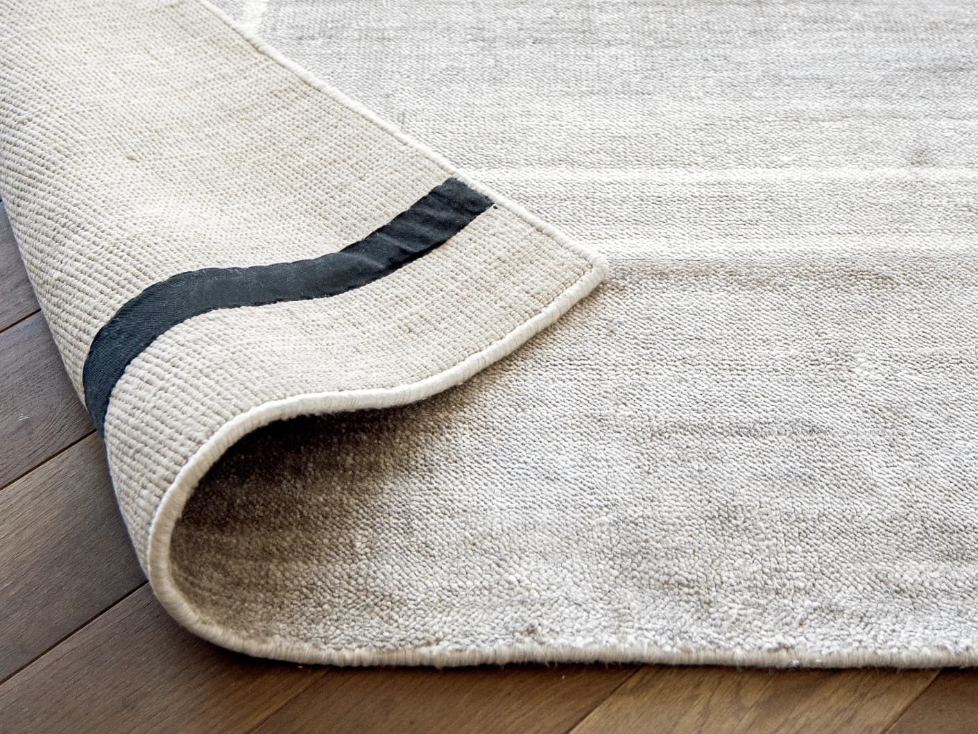 Colin Alba carpets in white and grey, shown in a product close-up view