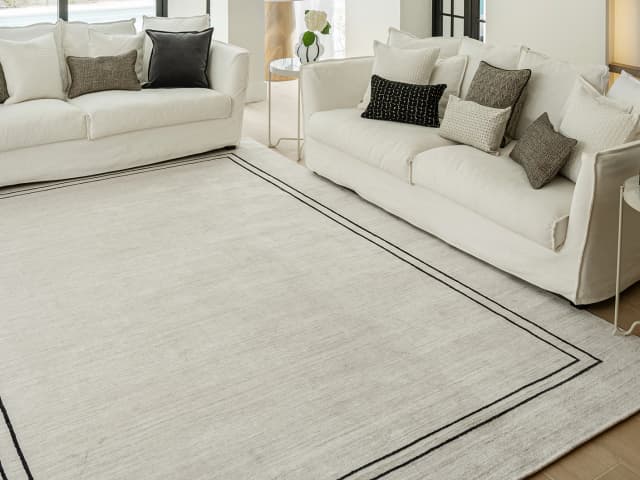 Colin Bianca carpet in white, black and pearl, shown in a lifestyle top view as image 5