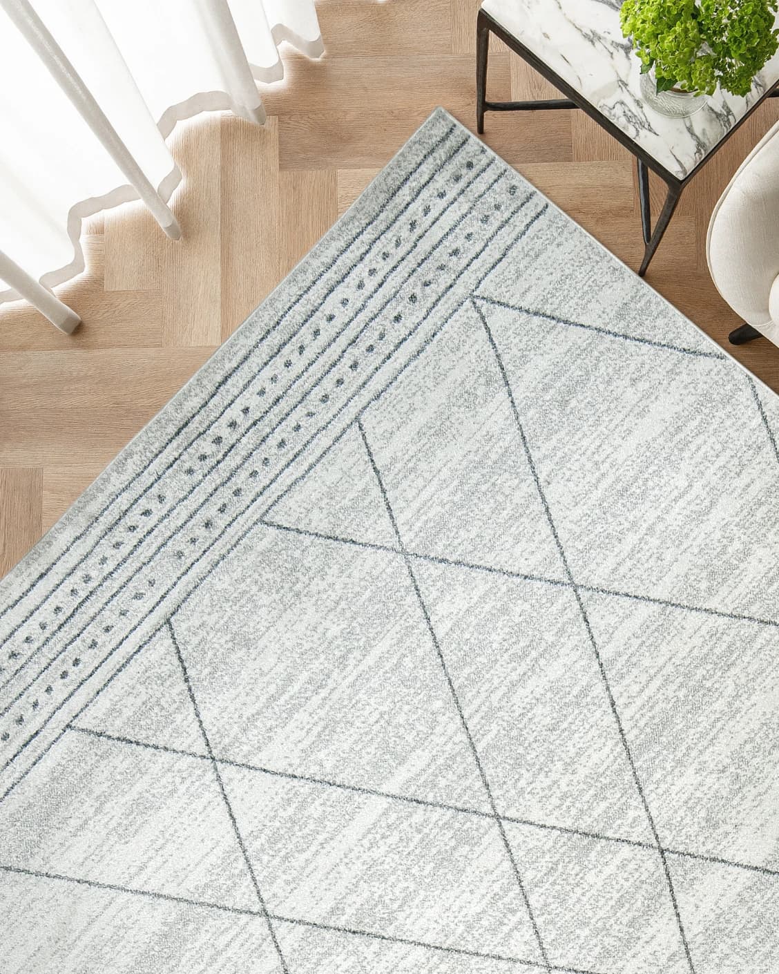 Conrad Bianca carpet in grey and white, shown in a lifestyle top view as image 2