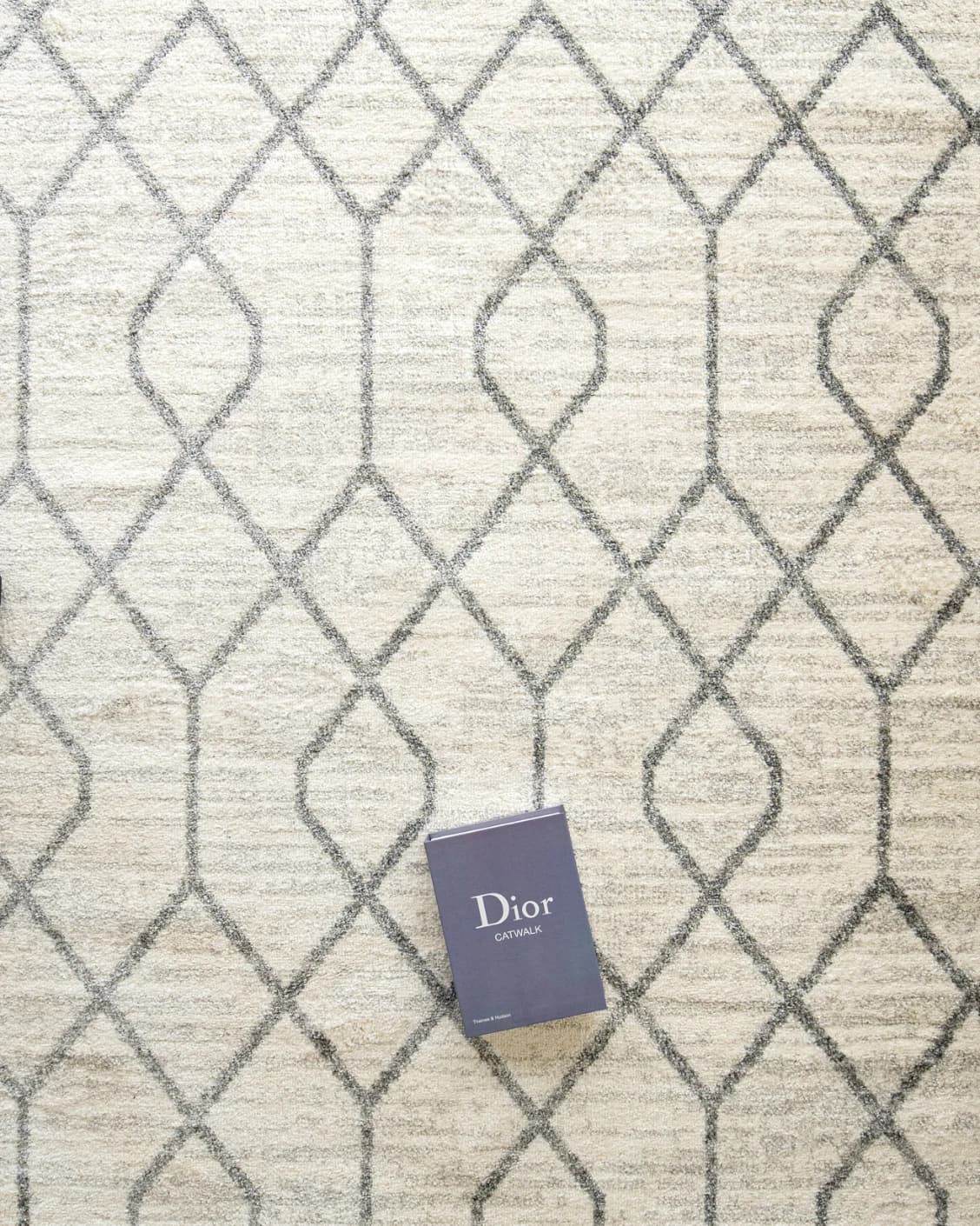 Conrad Lily carpet in ivory and grey, shown in a lifestyle top view as image 6