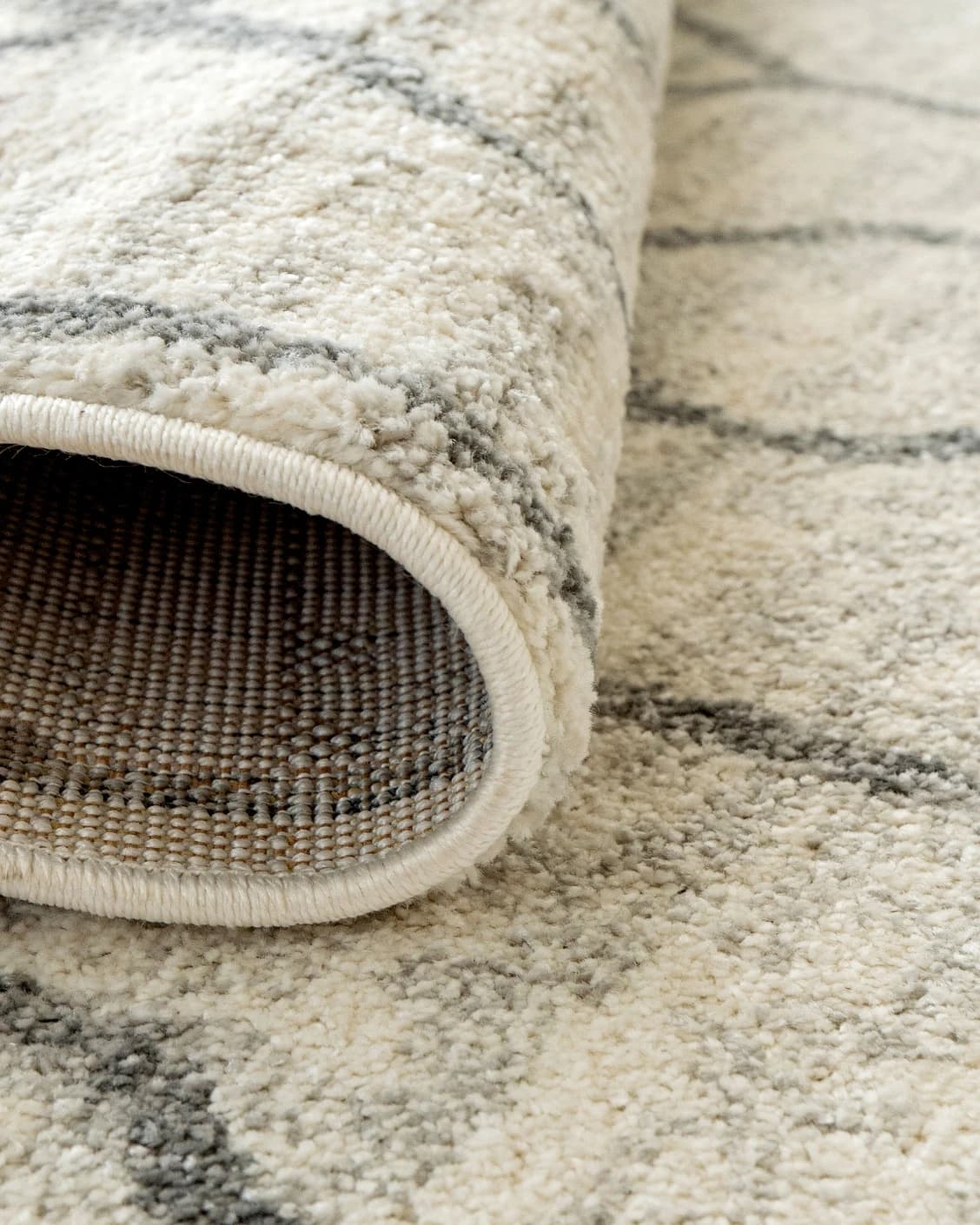 Conrad Lily carpet in ivory and grey, shown in a product close-up as image 7