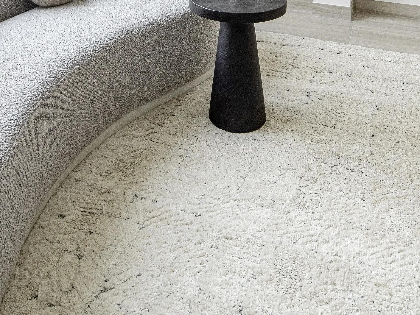 Conrad Sandy carpets in beige and grey, shown in a lifestyle close-up as image 2