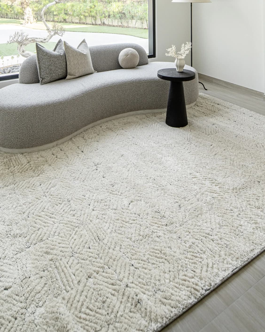 Conrad Sandy carpet in beige and grey, shown in a lifestyle left view as image 6