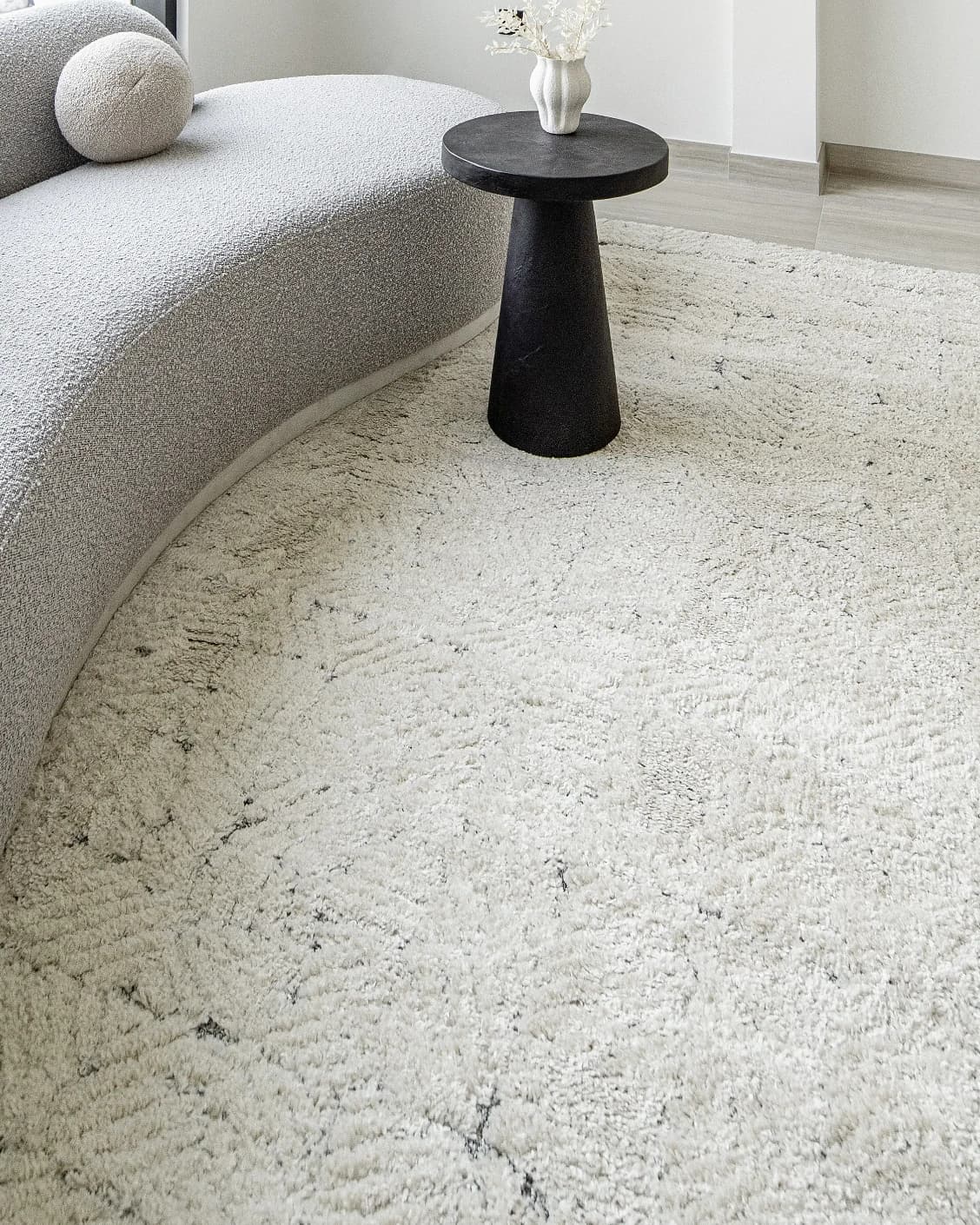 Conrad Sandy carpet in beige and grey, shown in a lifestyle left view as image 7