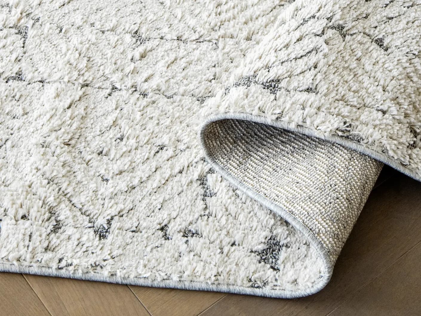 Conrad Sandy carpets in sandy, beige and grey, shown in a product close-up view