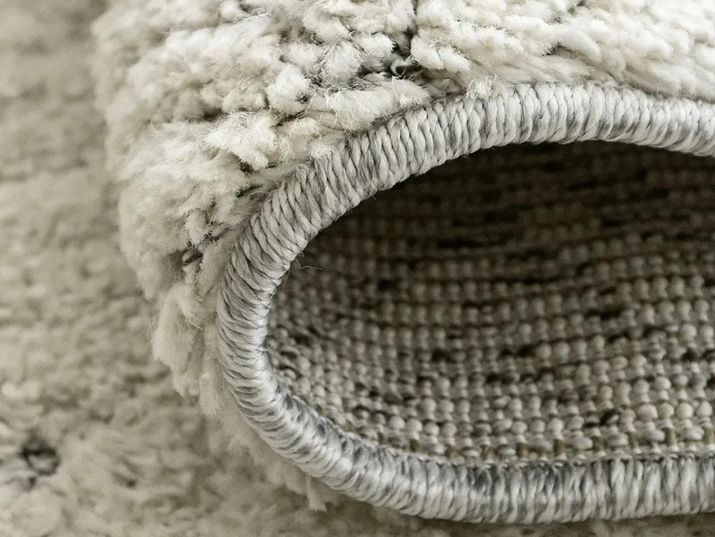 Conrad Sandy carpet in beige and grey, shown in a product close-up as image 11