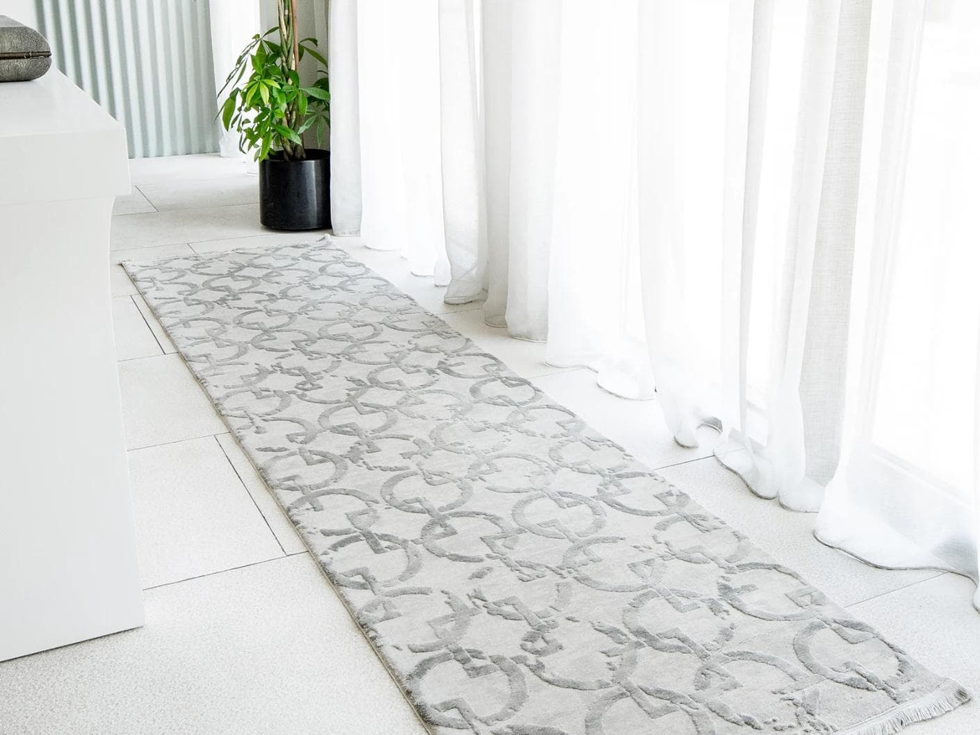 Cooper Dune carpets in grey and silver, shown in a lifestyle left view as image 1