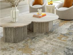Cooper Goldberg carpet in grey and gold, shown in a lifestyle close-up front view