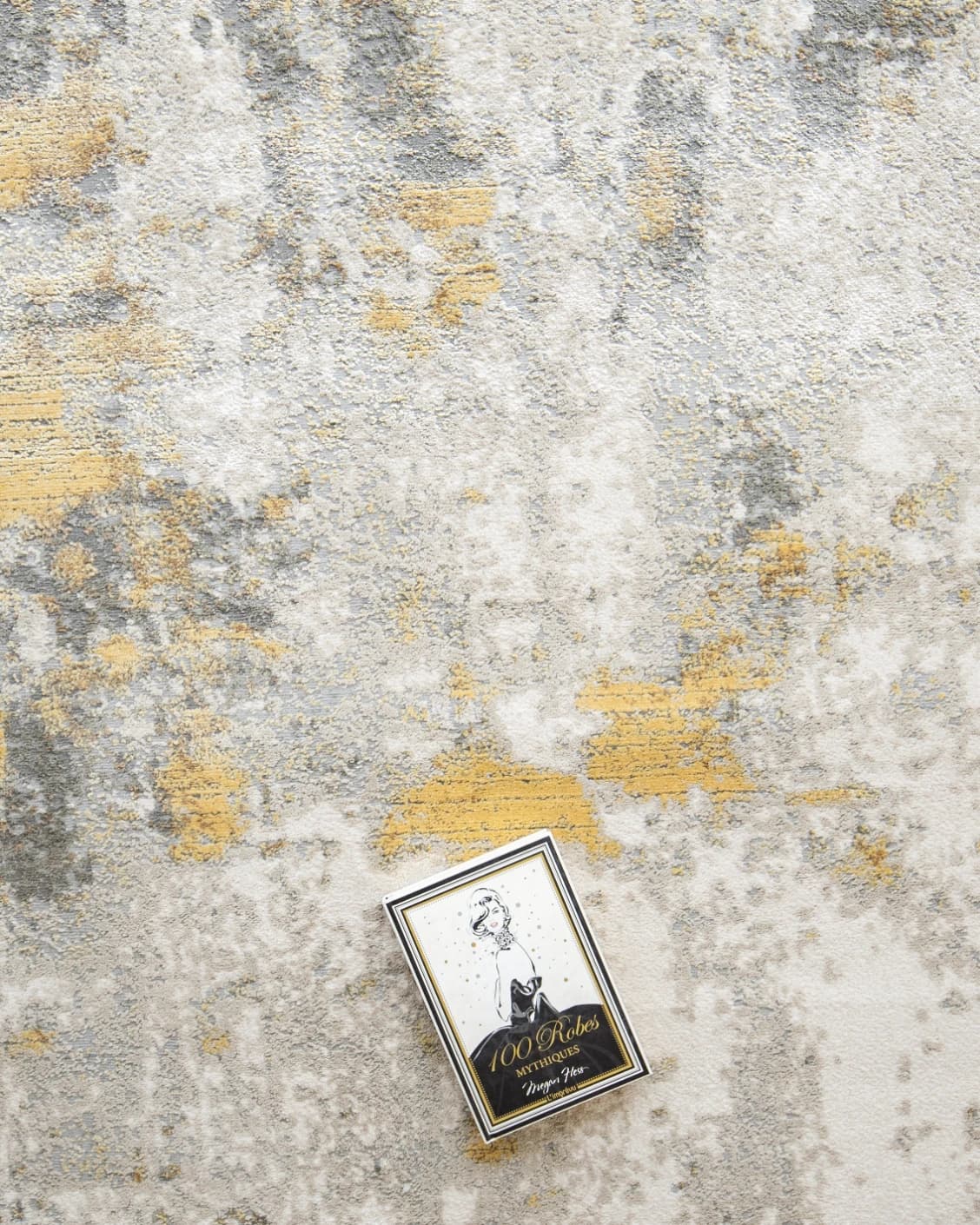 Cooper Goldberg carpet in grey and gold, shown in a lifestyle top view as image 9