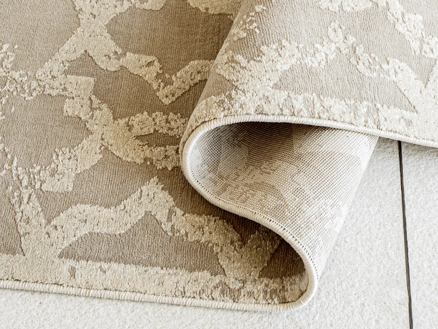 Cooper Sandy Runners carpets in sandy, beige and ivory, shown in a product close-up view