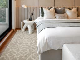 Cooper Sandy carpet in sandy, beige and ivory, shown in a lifestyle front view