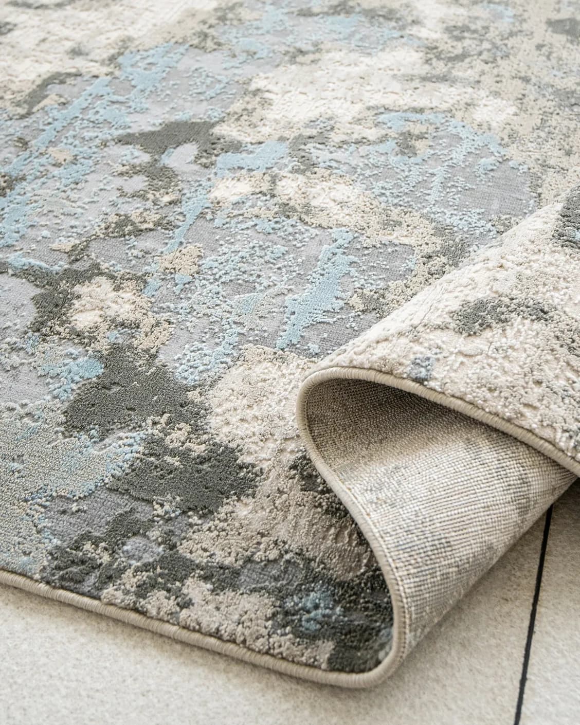 Cooper Sky carpet in sky, blue and grey, shown in a product close-up as image 15