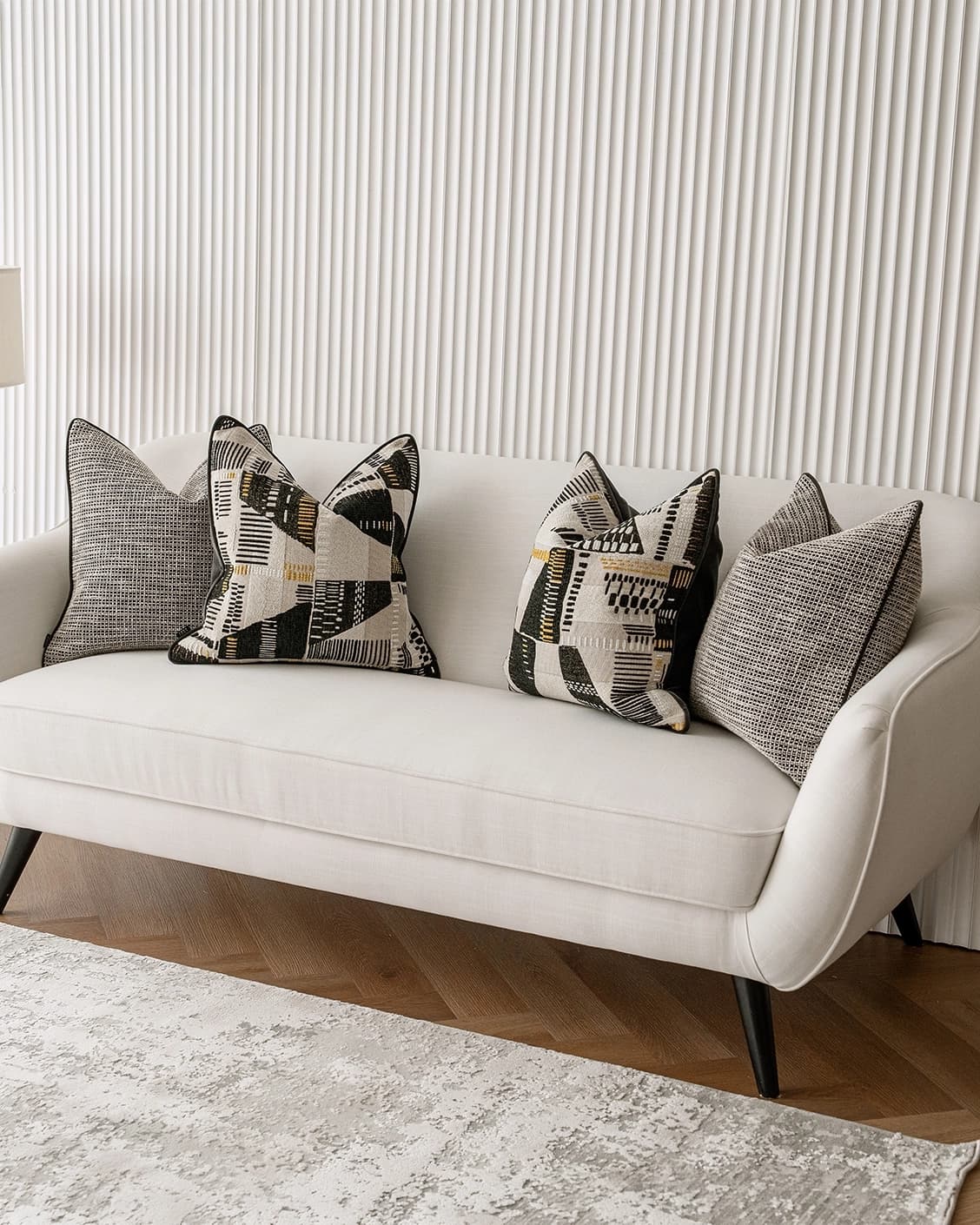 Corbin Bundle cushion in black and beige, shown in a lifestyle right view as image 2