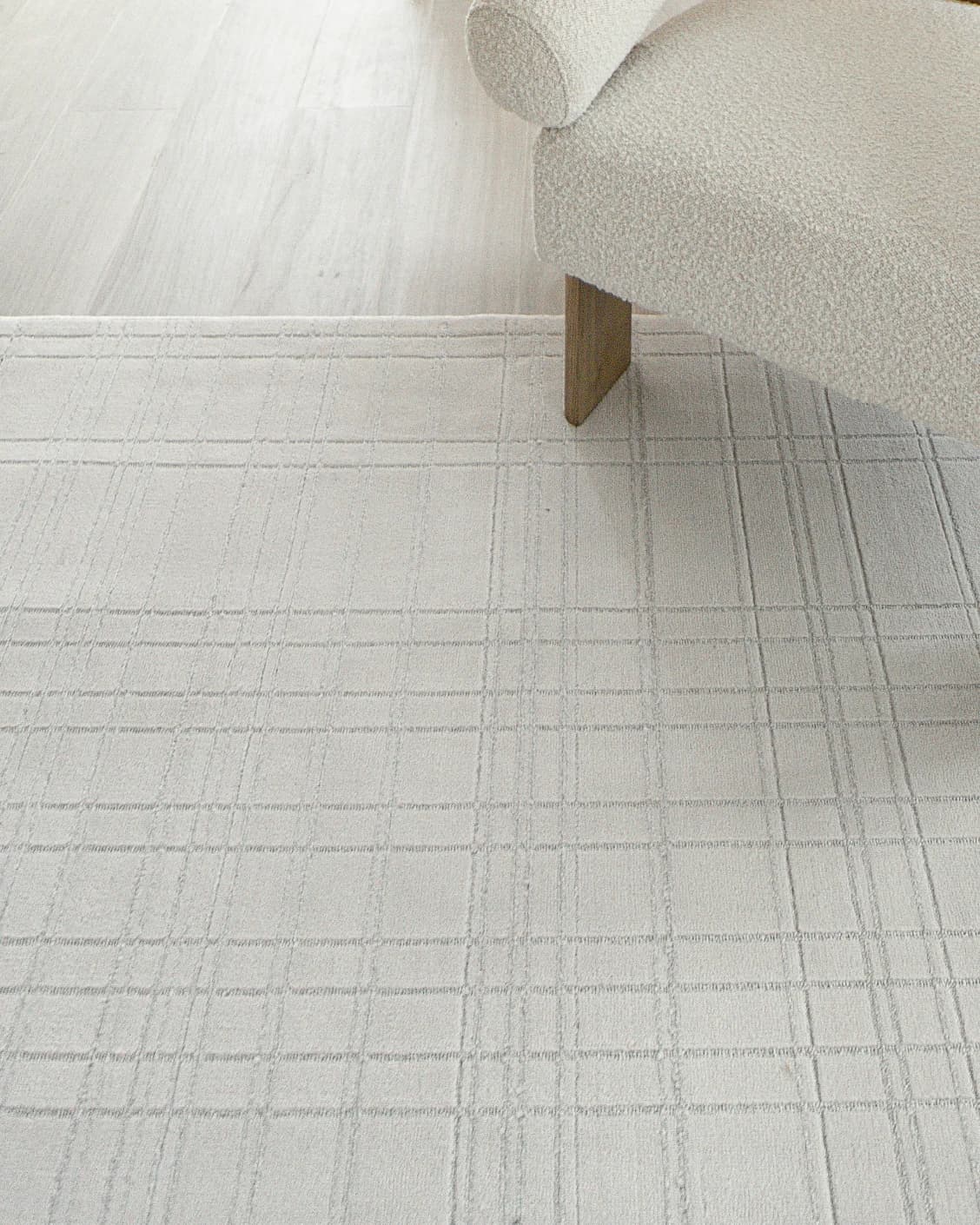 Corvin Sandy carpet in ivory and grey, shown in a lifestyle close-up as image 5