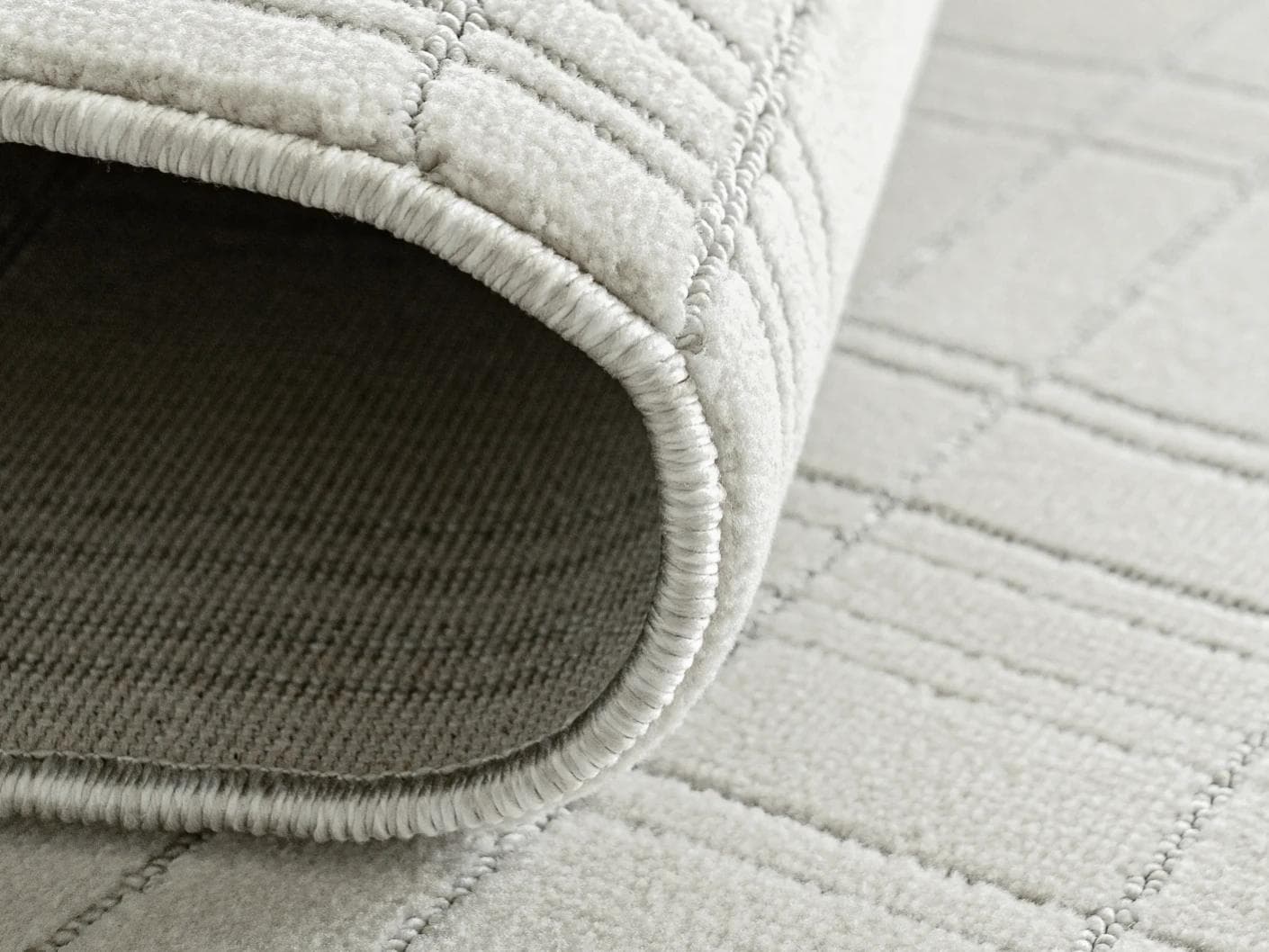 Corvin Sandy carpet in ivory and grey, shown in a product close-up as image 11