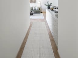 Corvin Sandy Runners carpet in sandy, ivory and grey, shown in a lifestyle front view