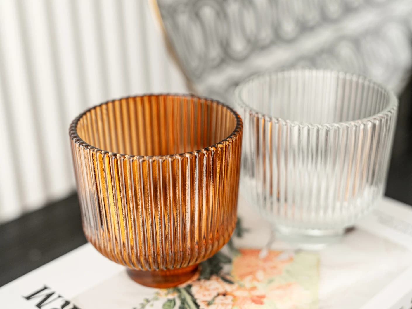 Crista Bundle vases in brown and translucent, shown in a lifestyle front view