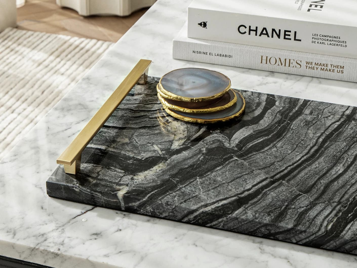 Daniel Bandiagara trays in gold and black, shown in a lifestyle top view