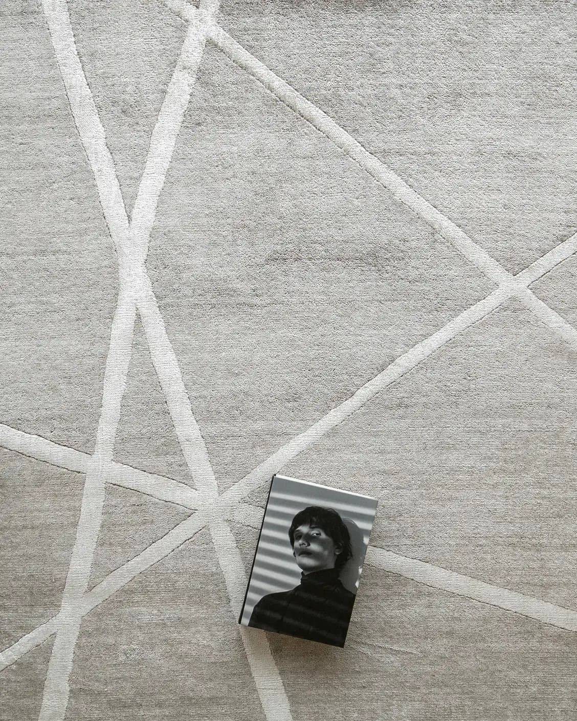 Dash Alba carpet in grey and ivory, shown in a lifestyle top view as image 9