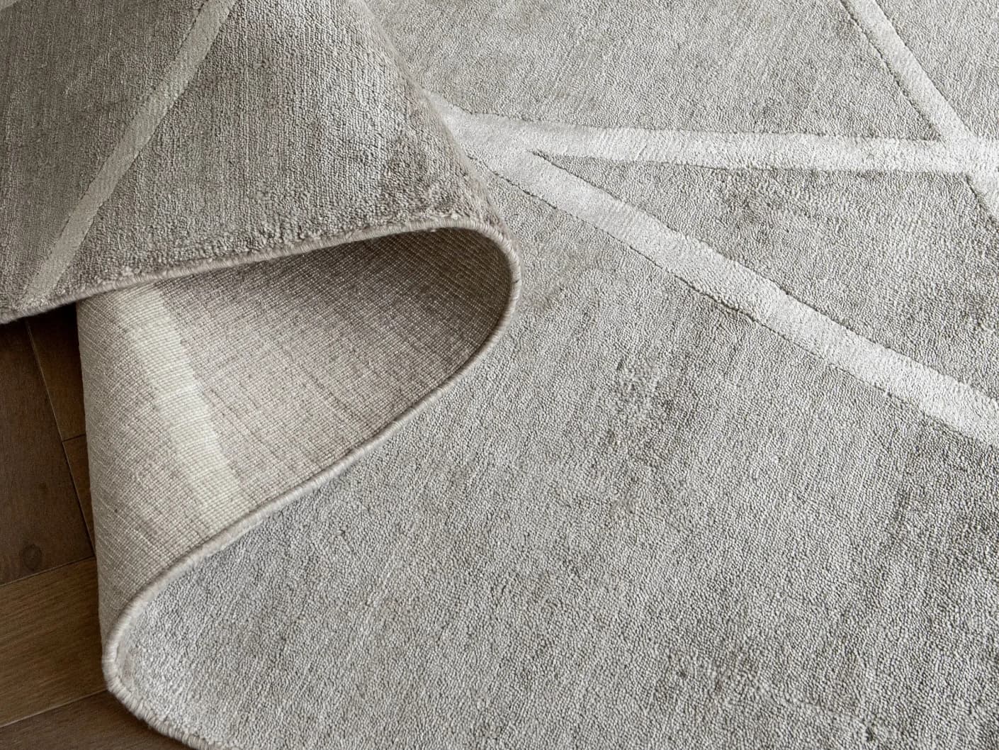 Dash Alba carpets in grey and ivory, shown in a product top view