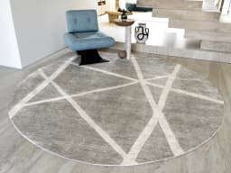 Dash Alba Round carpet in grey and ivory, shown in a lifestyle front view