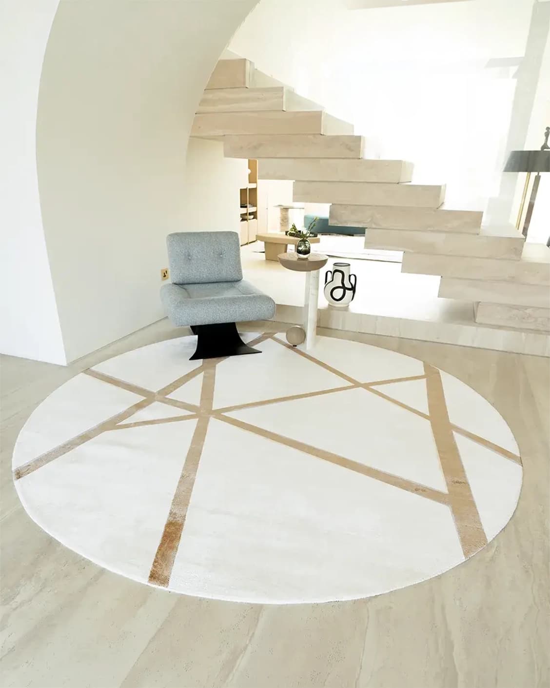 Dash Goldberg Round carpet in gold and off white, shown in a lifestyle front view as image 2