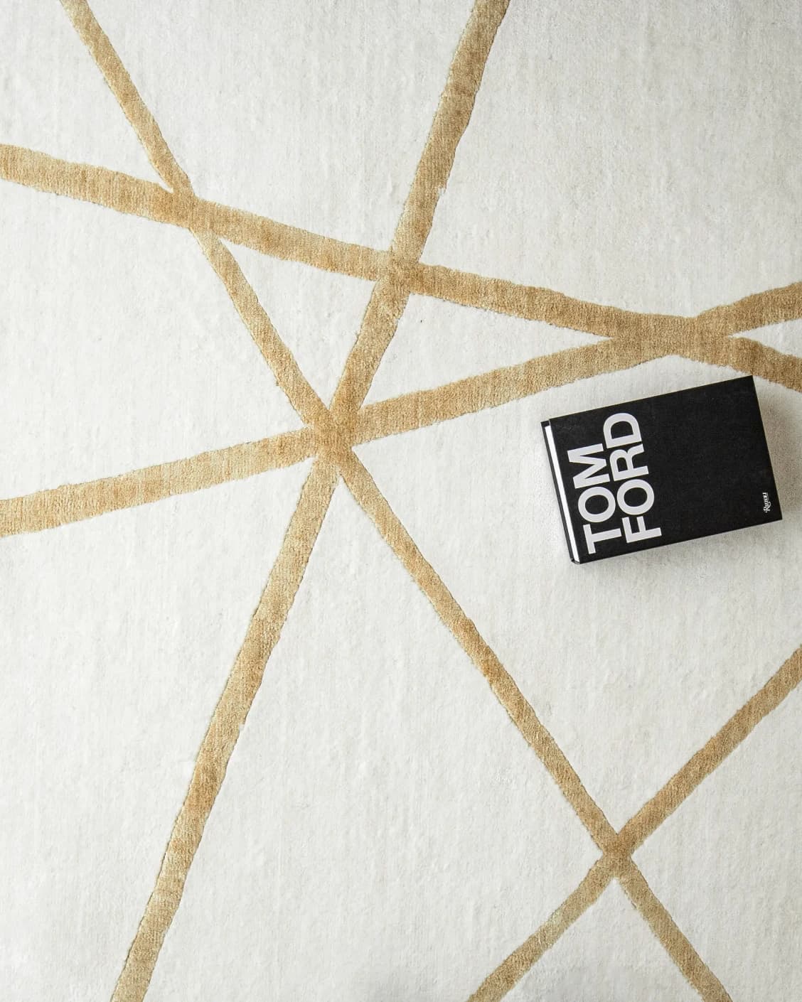 Dash Goldberg carpet in gold and off white, shown in a lifestyle top view as image 9