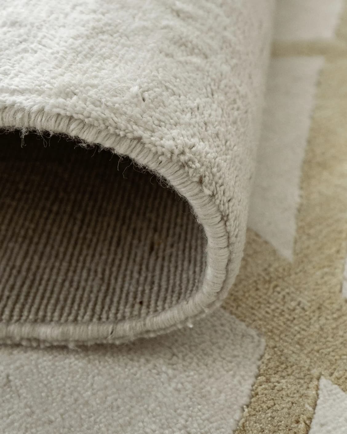 Dash Goldberg carpet in gold and off white, shown in a product close-up as image 10