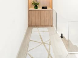 Dash Goldberg Runners carpet in gold and off white, shown in a product front view