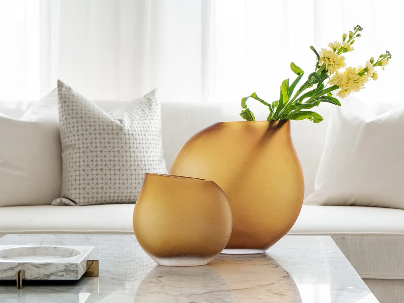 Denise Bundle vases in orange, shown in a lifestyle front view