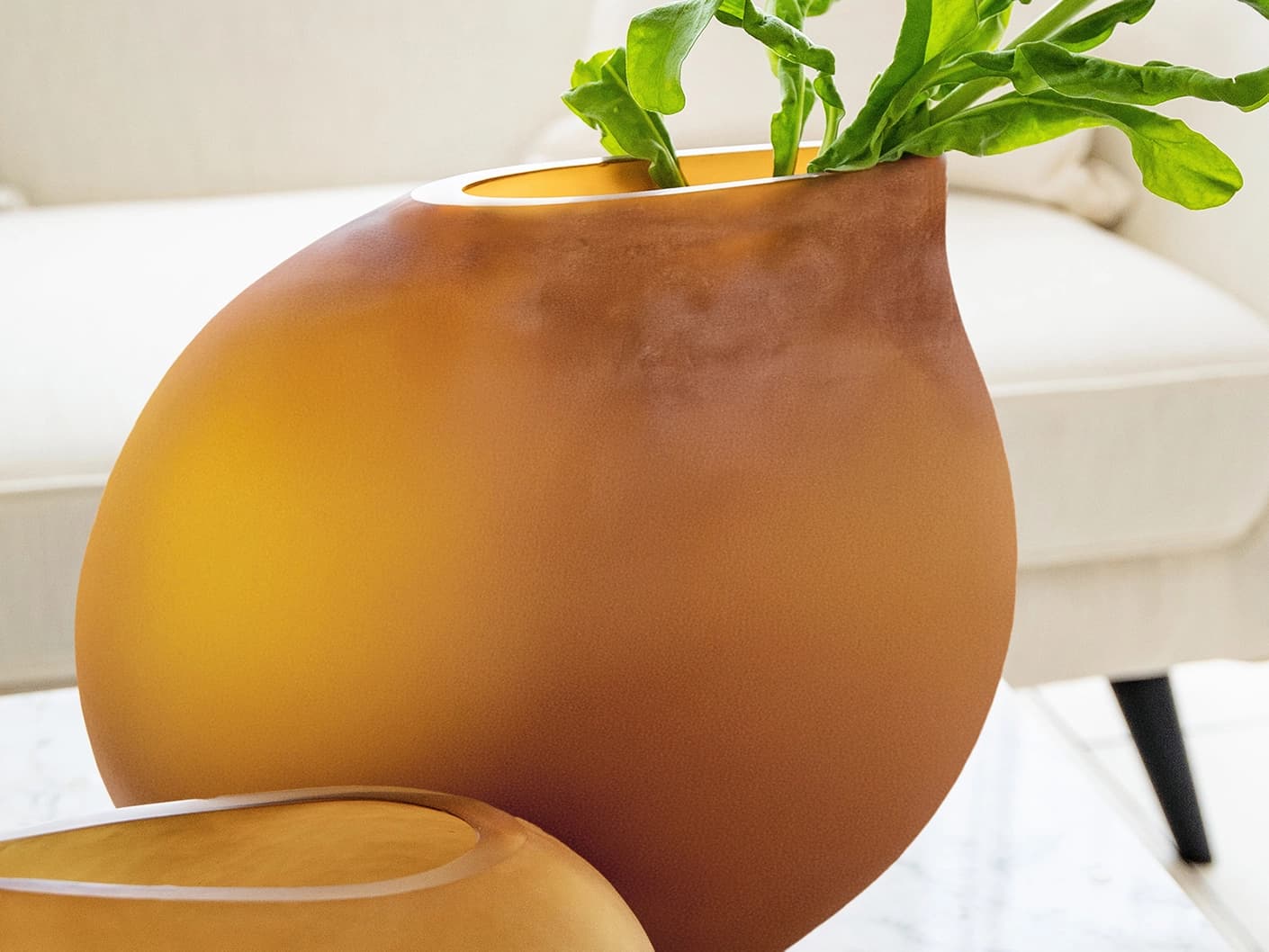 Denise Bundle vases in orange, shown in a lifestyle left view as image 3