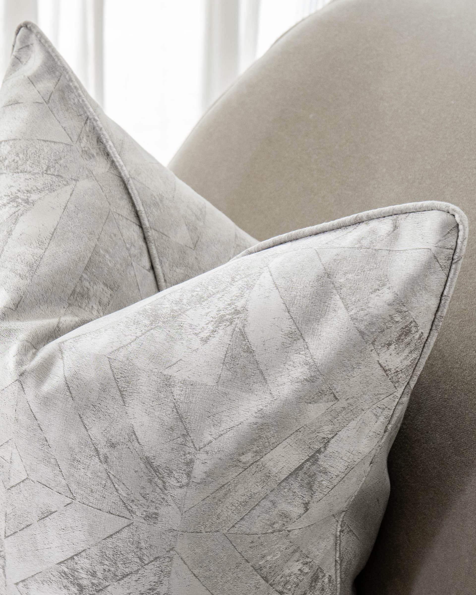 Diana Laurent cushion in silver, shown in a lifestyle top view as image 5