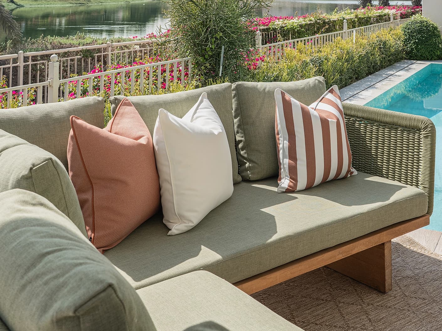 Donya Bundle bundle cushions in ivory and rust, shown in a lifestyle front view