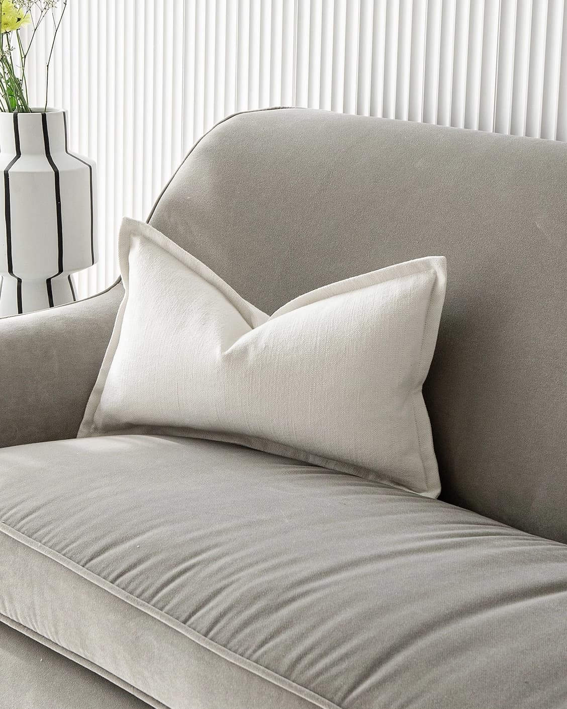 Dorothy Bianca II cushion in white, shown in a lifestyle front view as image 2
