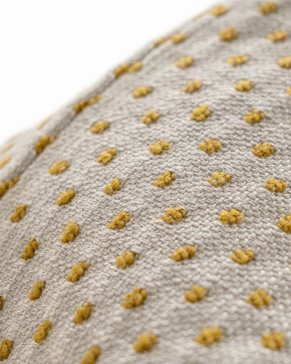 Dotty Barrymore III cushion in beige and grey, shown in a product close-up right view as image 6
