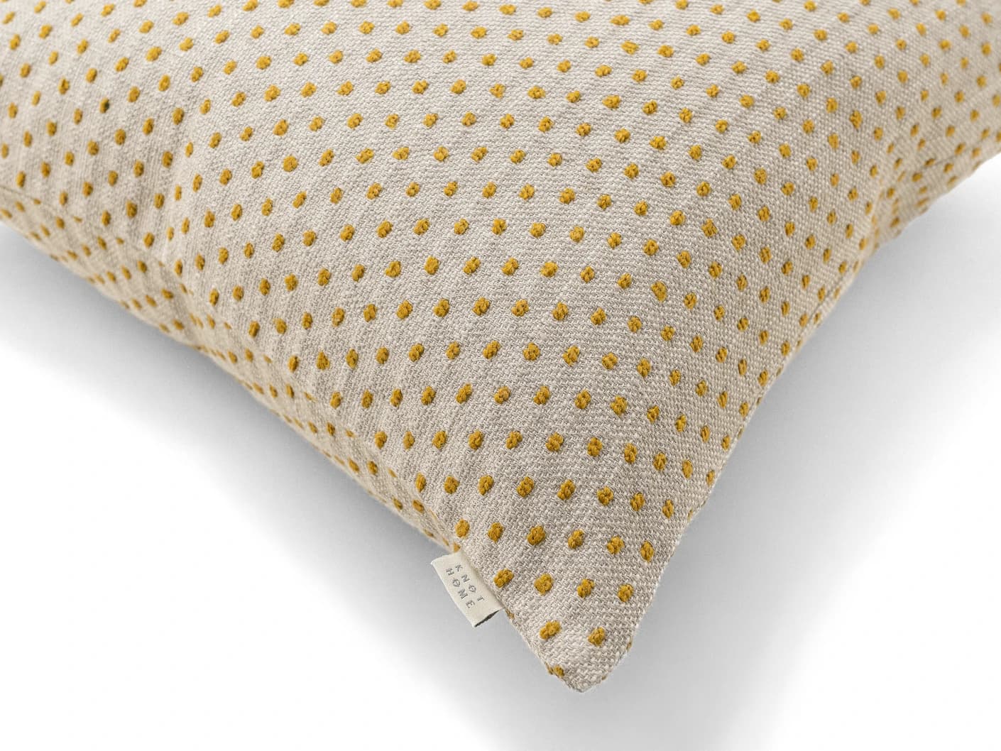 Dotty Barrymore III cushion in beige and grey, shown in a product close-up top view as image 7