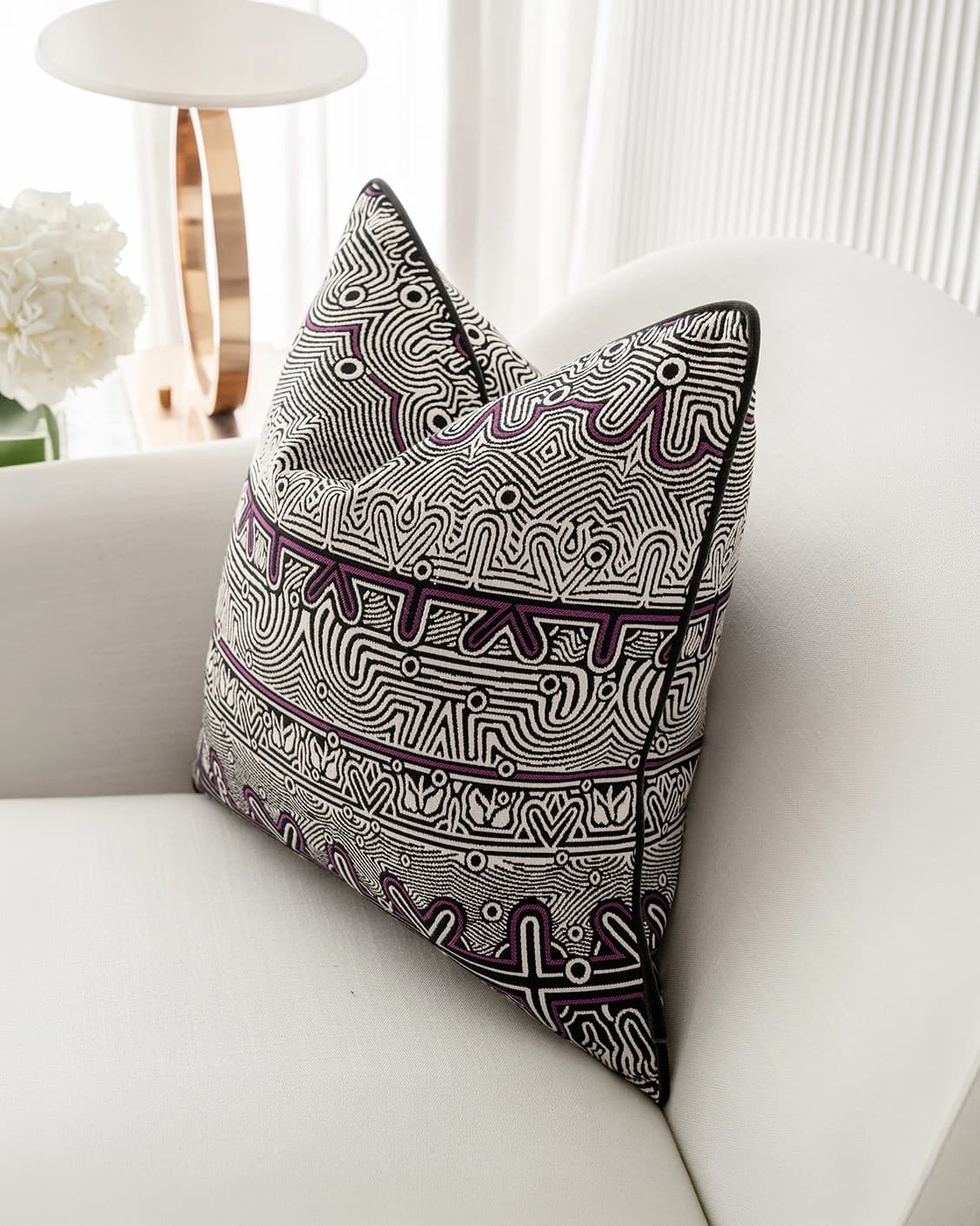 Edda Mauve cushion in black and silver, shown in a lifestyle right view as image 2