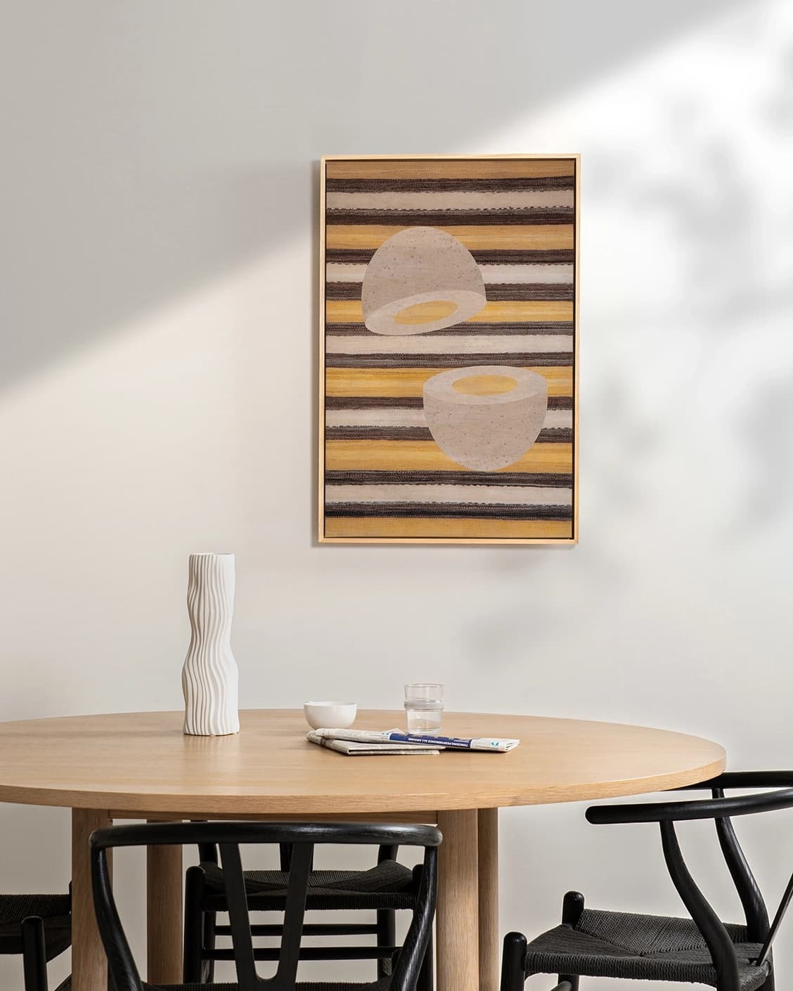 Eggsercise canvas in yellow, brown and beige, shown in a lifestyle front view as image 3