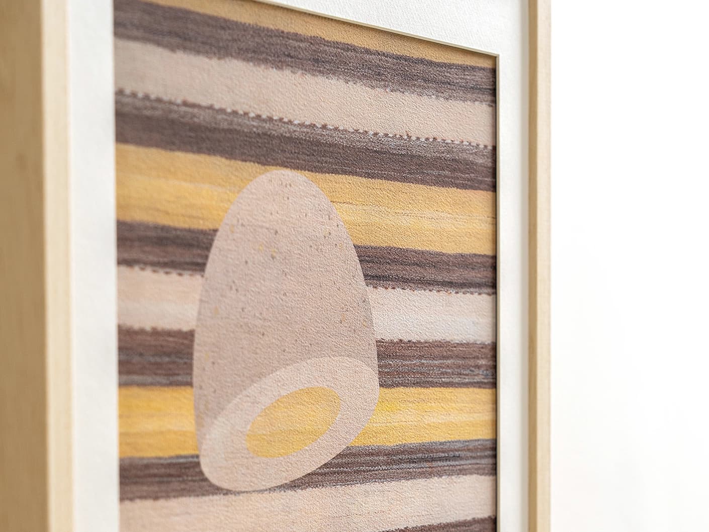 Eggsercise fine art print in yellow, brown and beige, shown in a lifestyle close-up view as image 2
